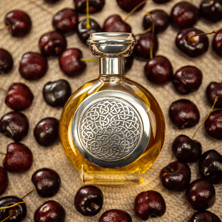 Bodacious perfume bottle surrounded by cherries